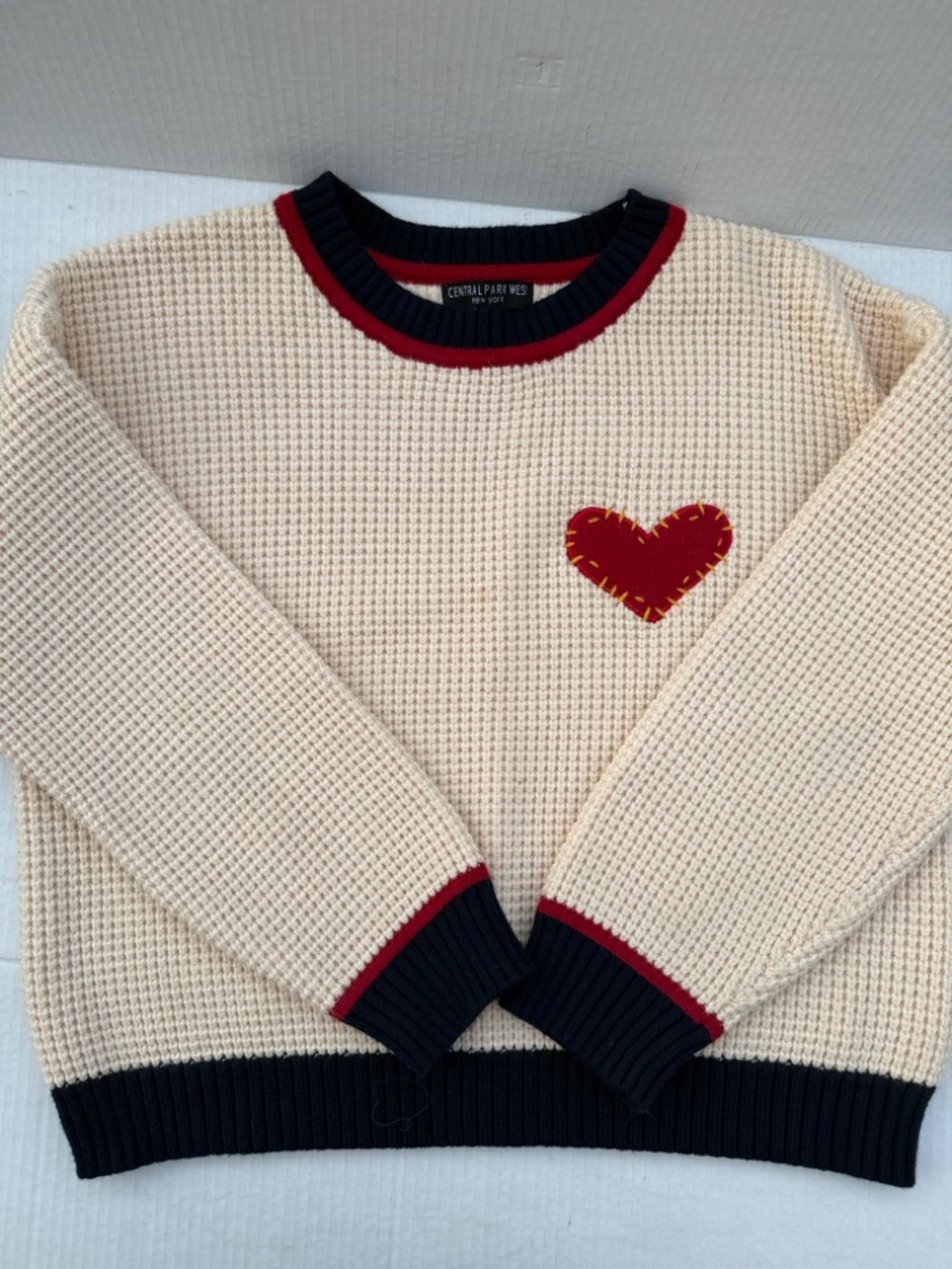 Central Park West Cream Waffle Knit Sweater with Red Heart and Navy Trim